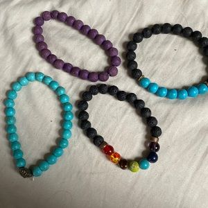 Assortment of 4 different beaded / lava stone bracelets